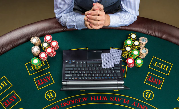 Casino Online Gambling Technology People Concept Close Up Poker Player With Playing Cards Laptop Chips Green Casino Table 157927 2878